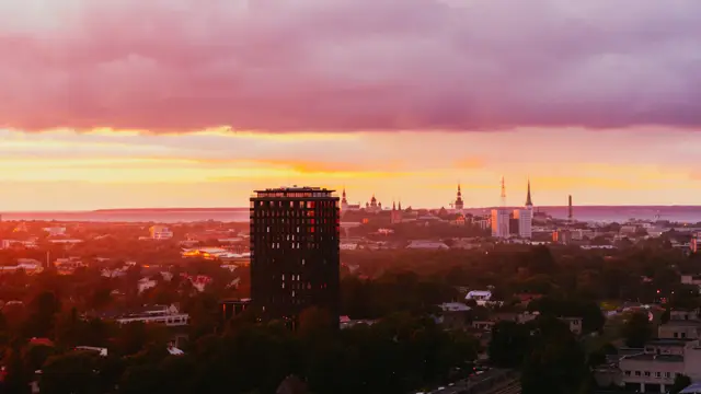 Medieval towers of Tallinn old town with the modern city skyline behind