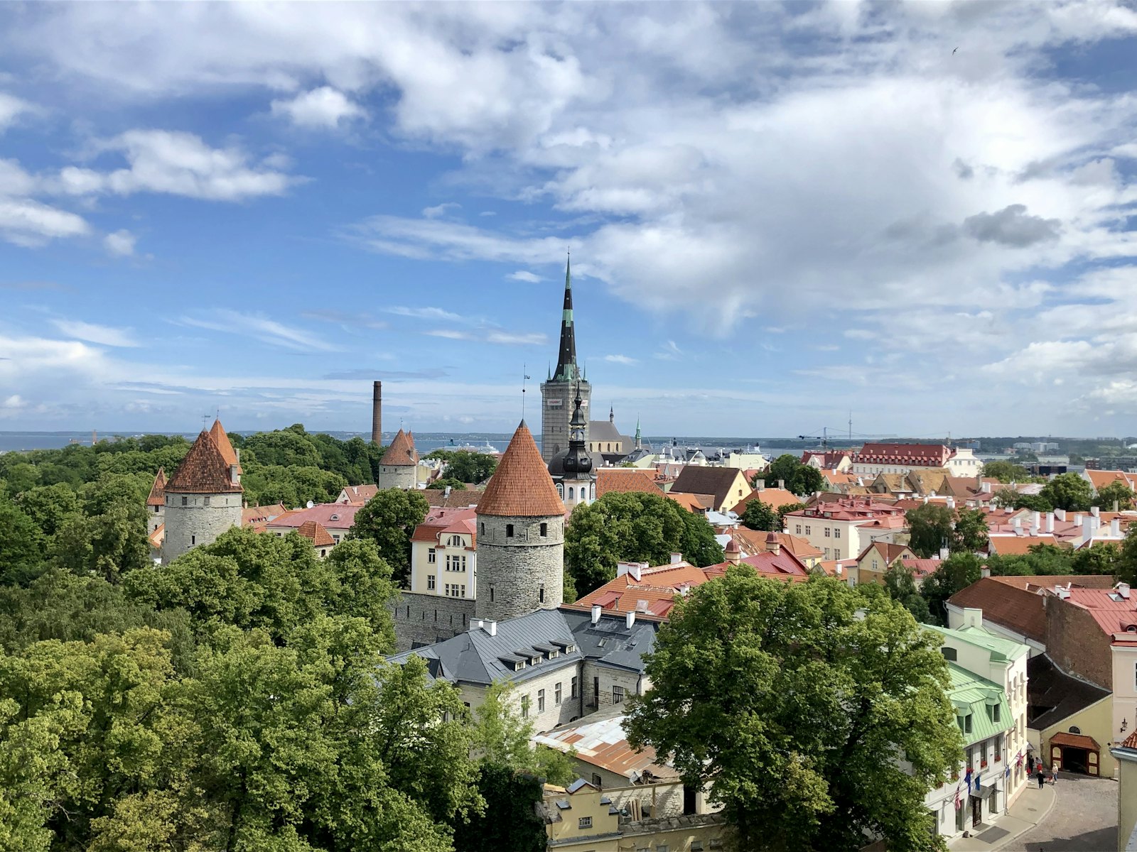 Medieval towers of Tallinn old town with the modern city skyline behind